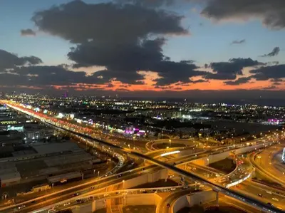 a busy highway at night with lights on at Aykon City 2 bedroom Burj view in Dubai