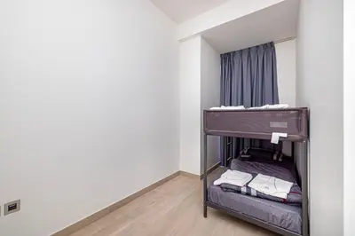 a small bedroom with a bunk bed in a room at High Floor Brand New Apartment - 34 in Dubai