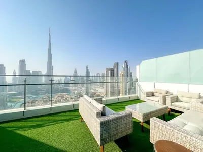 a balcony with furniture and a view of the city at Panoramic Burj Khalifa View Luxury 2BR Penthouse in Dubai
