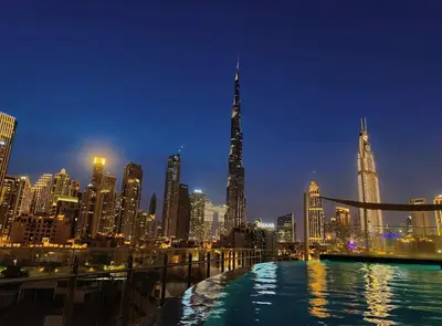 a view of a city skyline at night at Panoramic Burj Khalifa View Luxury 2BR Penthouse in Dubai