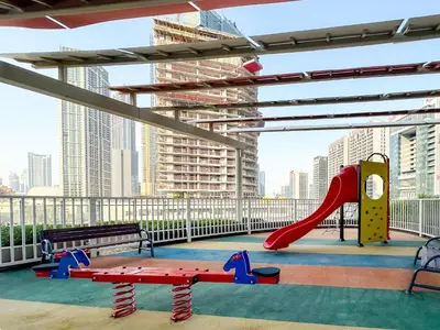 a play area with a slide and a playground at Panoramic Burj Khalifa View Luxury 2BR Penthouse in Dubai