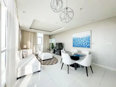 a living room with a couch and a table at Panoramic Burj Khalifa View Luxury 1BR Penthouse in Dubai