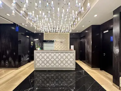 a lobby with a chandelier in a building at Panoramic Burj Khalifa View Luxury 1BR Penthouse in Dubai