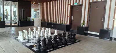 a chess board on a display in a room at Bayz by Danube Marasi Drive in Dubai