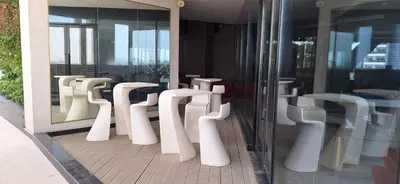 a row of white toilets in a building at Bayz by Danube Marasi Drive in Dubai