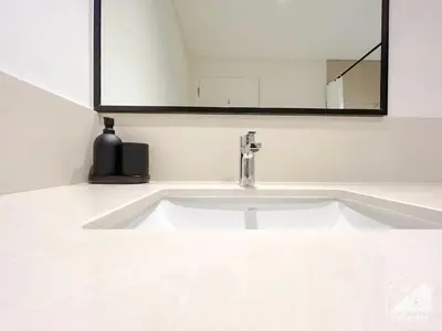 a white sink in a bathroom with a mirror at Luxury Burj Crown Downtown Balcony & View in Dubai