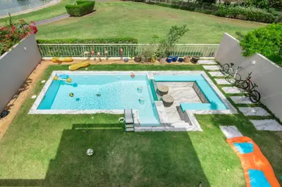 an overhead view of a swimming pool in a yard at Elegant lakeside villa with a private pool in Dubai