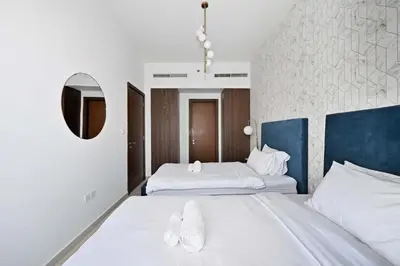 a hotel room with two beds and a mirror at Stunning Canal Views l Sleeps 6 in Dubai
