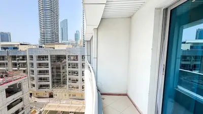 a balcony with a view of a city at Dubai Marina - Modern Classic Studio Apartment in Dubai