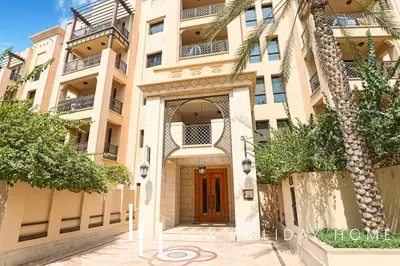 a large apartment building with a brown door at LUX The Burj Khalifa View Downtown Suite in Dubai