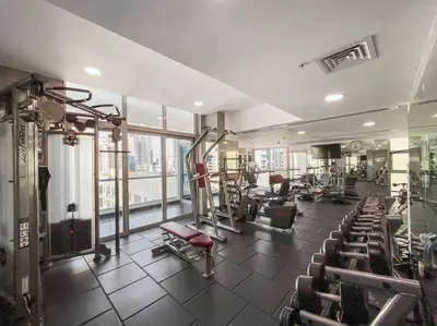 a gym with a lot of equipment in a room at Studio -DEC Towers T2 - Near Marina Beach in Dubai