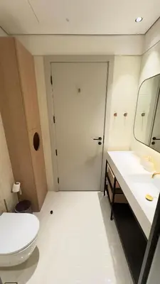 a bathroom with a toilet and a sink and a mirror at Stylish apartment in the center!10 minutes to Dubai mall and World Trade Center in Dubai