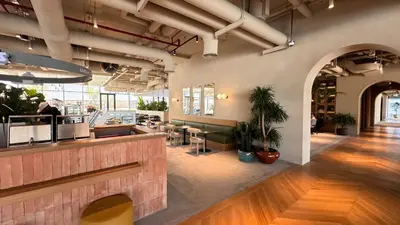 a lobby of a restaurant with a counter and tables at Stylish apartment in the center!10 minutes to Dubai mall and World Trade Center in Dubai