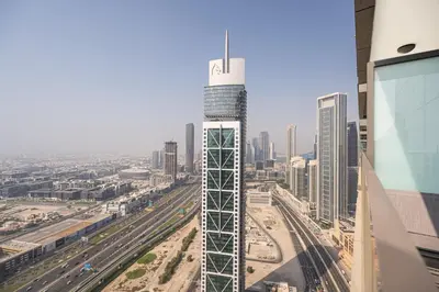 a view of a city with a tall building at Escape24 Spacious 2BR Infinity Pool with Burj Views in Dubai