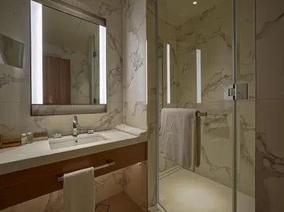a bathroom with a sink and a shower at Venetian - The Address Residences Dubai Opera Full Burj & Fountain Views in Dubai