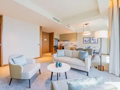 a living room with a couch and chairs and a table at Luxury 3BR Apartment at Address Opera in Dubai