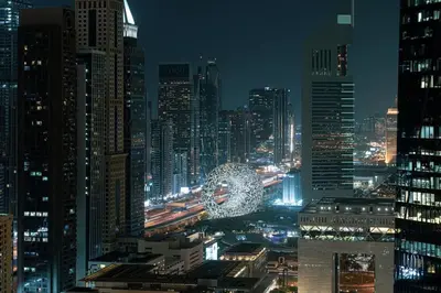a view of a city at night with a large at DIFC Luxury 1-Bed Apt with Stunning City Views in Dubai