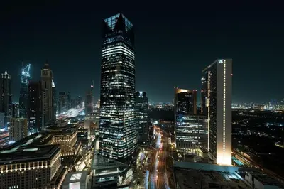a city skyline at night with tall buildings at DIFC Luxury 1-Bed Apt with Stunning City Views in Dubai