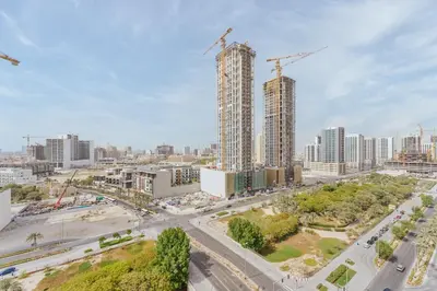 an aerial view of a city with tall buildings at Stylish 1BR in JVC with Pool & Nearby Parks in Dubai