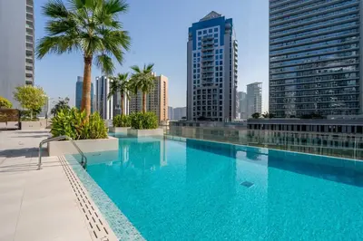 a swimming pool in the middle of a city with tall buildings at GuestReady - Modern retreat in Business Bay in Dubai