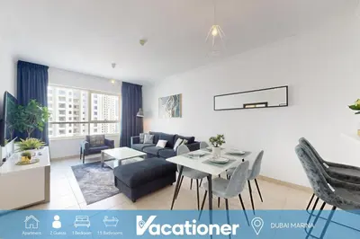 a living room with a couch and a table at Marina Quays - Calm One Bedroom in Dubai