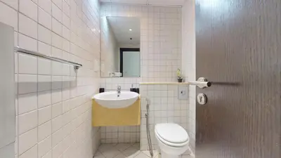 a bathroom with a toilet and a sink at Marina Quays - Calm One Bedroom in Dubai
