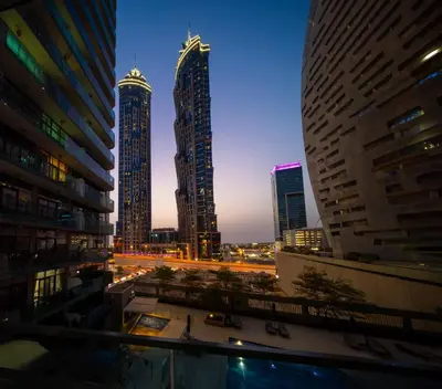 a city skyline at night with tall buildings at Chic 1BR Getaway- 4min Walk to Business Bay Metro & 10min to Burj Khalifa in Dubai