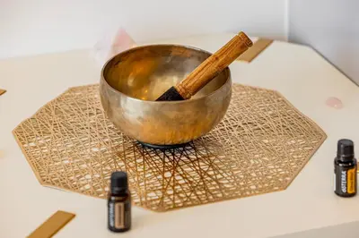 a metal bowl with a stick in it on a counter at Luxury Apt in Dubai Hills Burj Khalifa views in Dubai