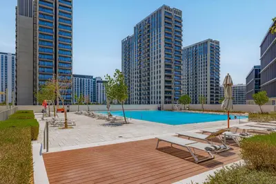 a swimming pool in a city with tall buildings at Luxury Apt in Dubai Hills Burj Khalifa views in Dubai