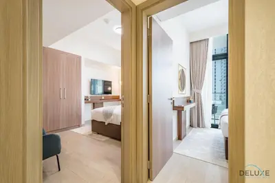 a hotel room with a bedroom and a bed at Inviting 2BR Apartment in Azizi Riviera 39, Al Merkadh by Deluxe Holiday Homes in Dubai