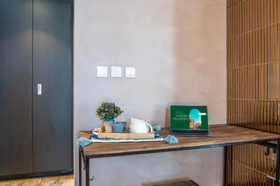 a desk with a laptop on top of it at Paradise of the Mind by Lagom in Dubai