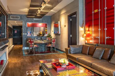 a living room with a couch and a kitchen at Paradise of the Mind by Lagom in Dubai