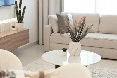 a living room with a table and a couch at Burj Crown - Urban Chic Opera Boulevard View, Walk to Dubai Mall in Dubai