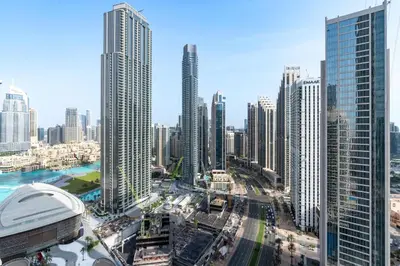 a city skyline with tall buildings in a city at Vacay Lettings - Lofts Apartments in Dubai