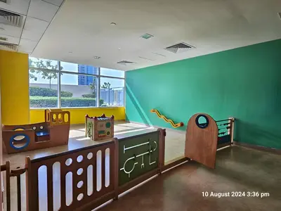a childs room with two beds and a crib at Vacay Lettings - Lofts Apartments in Dubai