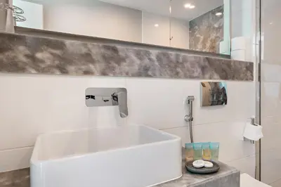 a bathroom with a white sink and a mirror at InstaWorthy Aesthetic 1BR APT, 5mins to Dubai Mall in Dubai