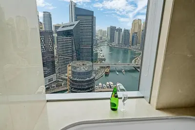 a bathroom window with a view of a city at Amazing 1 Bd Marina View LLC in Dubai
