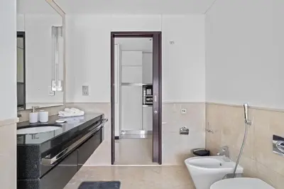 a bathroom with a toilet and a sink at Amazing 1 Bd Marina View LLC in Dubai