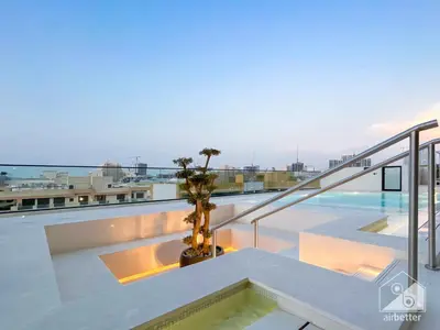 a swimming pool on the roof of a building at Chic 1-BR Apt & Balcony in Binghatti Heights in Dubai