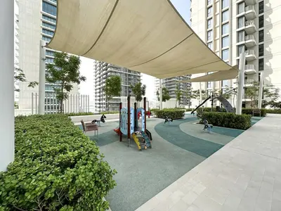 a playground in a building with people playing at Trophy - 1BR Beachfront Retreat w Lagoon Views in Dubai