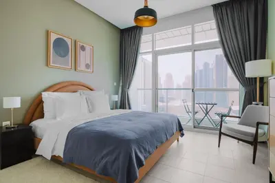 a bedroom with a bed and a large window at Blueground DIFC swimming pool gym security DXB-1545 in Dubai