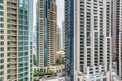 an aerial view of tall buildings in a city at Blueground Burj Residences BK view pool gym DXB-1131 in Dubai