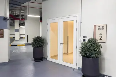 two potted plants sitting in front of a door at Blueground 5242 Tower sea view doorman pool DXB-867 in Dubai