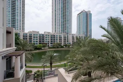 a view of a pond in a city with tall buildings at Frank Porter - Arno A in Dubai