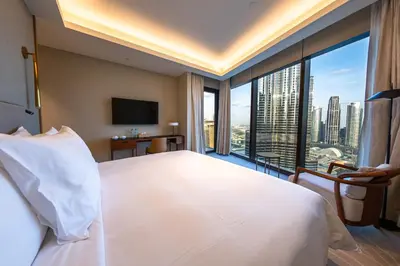 a bedroom with a large bed and a large window at Address Residence Opera, Downtown, Dubai in Dubai