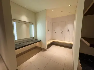 a dressing room with a large television on the wall at Address Residence Opera, Downtown, Dubai in Dubai
