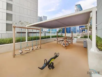 awning on the roof of a building with scissors at Special Deal 2BR with Canal Views & Relaxing Balcony by Deluxe Holiday Homes in Dubai