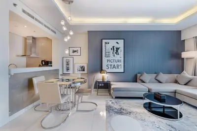 a living room with a couch and a table at ALiving Modern & Chic 1BR I Paramount Tower D -2203 in Dubai