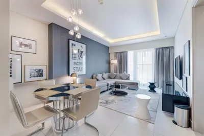 a living room with a couch and a table at ALiving Modern & Chic 1BR I Paramount Tower D -2203 in Dubai