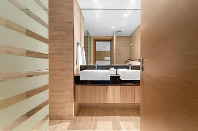 a bathroom with two sinks and a mirror at ALiving Classy 1BR I Near Burj Khalifa & Dubai Mall I Missoni Tower- 211 in Dubai